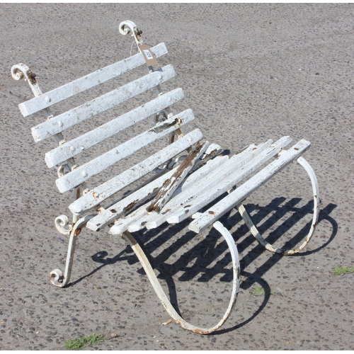 329 - A Victorian wrought iron and wooden painted garden bench or chair, layers of paint