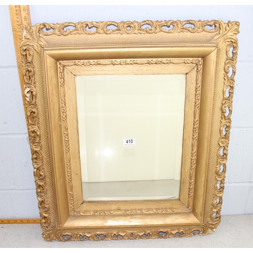 410 - An antique carved wooden and gilt framed mirror