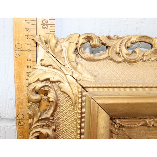 410 - An antique carved wooden and gilt framed mirror