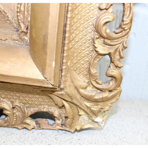 410 - An antique carved wooden and gilt framed mirror