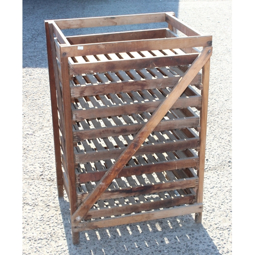 45 - A vintage rustic wooden apple rack with 8 slide out trays