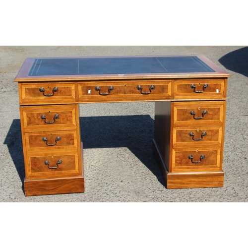 46 - A modern yew effect leather topped pedestal desk