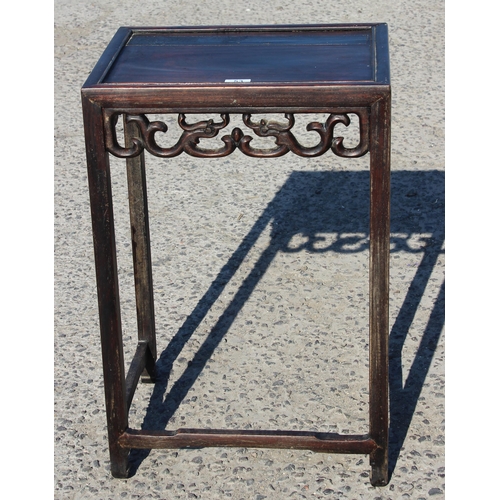 53 - A Chinese hardwood table with carved details