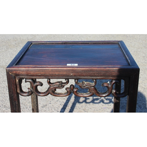 53 - A Chinese hardwood table with carved details