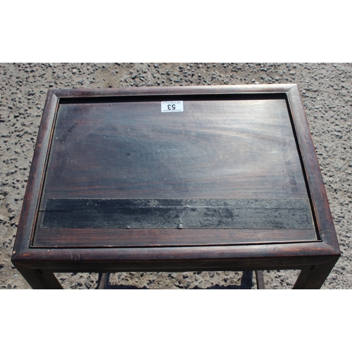 53 - A Chinese hardwood table with carved details