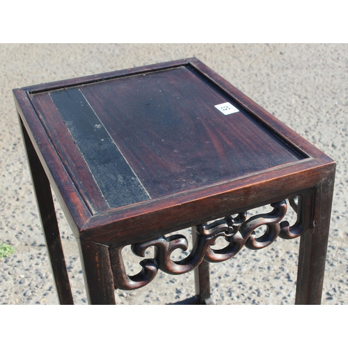 53 - A Chinese hardwood table with carved details