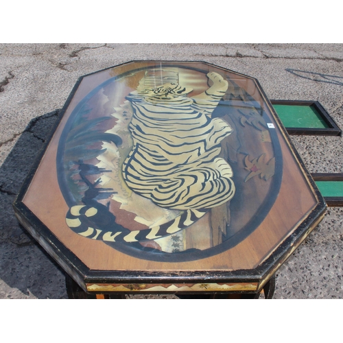 54 - An unusual large wooden and glazed coffee table formed with a fretwork scene of a Tiger