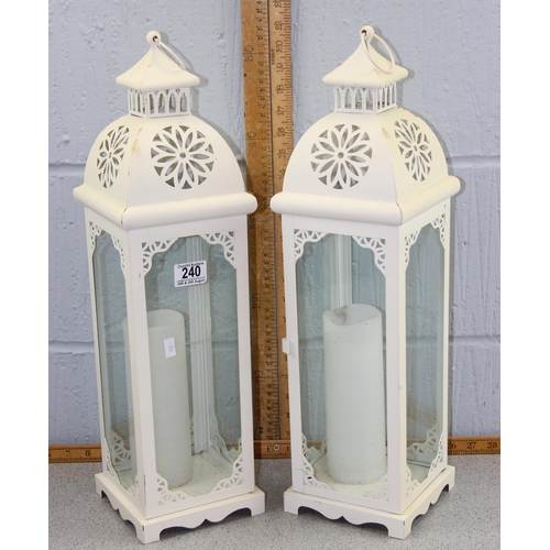 240 - 2 white painted metal candle lamps with candles