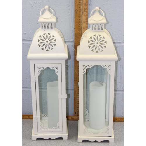 240 - 2 white painted metal candle lamps with candles