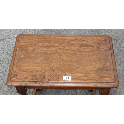 74 - An antique oak coffin stool with carved details and turned legs