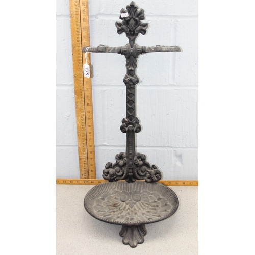 135 - A Victorian style cast iron stick stand with drip tray