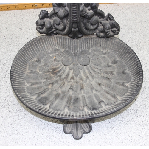 135 - A Victorian style cast iron stick stand with drip tray