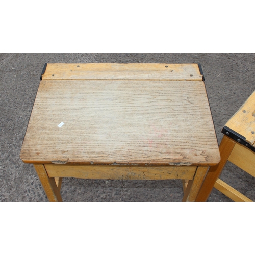 136 - A pair of vintage wooden school desks