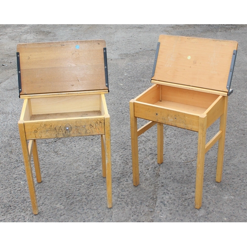 137 - A pair of vintage wooden school desks