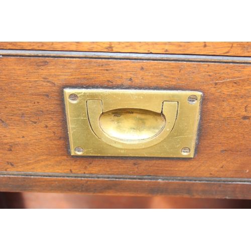 138 - A 20th century campaign style sideboard or drinks cabinet with 3 drawers over 2 cupboards and a slid... 