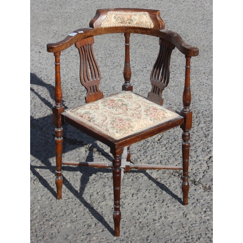 142 - An antique Edwardian corner chair with upholstered seat