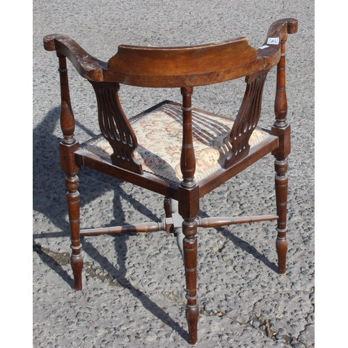 142 - An antique Edwardian corner chair with upholstered seat