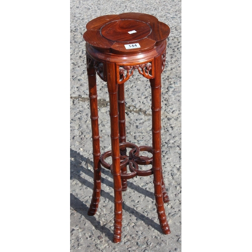 144 - A 20th century Chinese Rosewood jardinière or display stand with faux bamboo legs