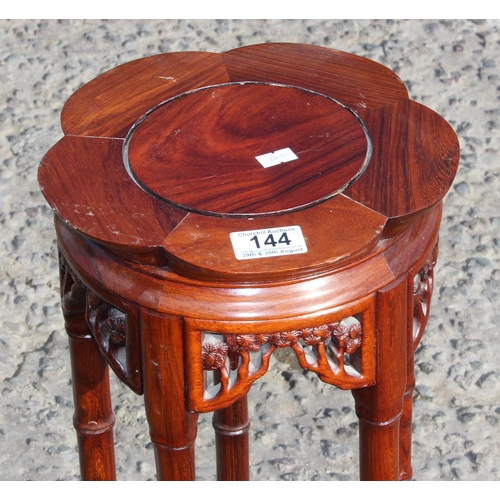 144 - A 20th century Chinese Rosewood jardinière or display stand with faux bamboo legs