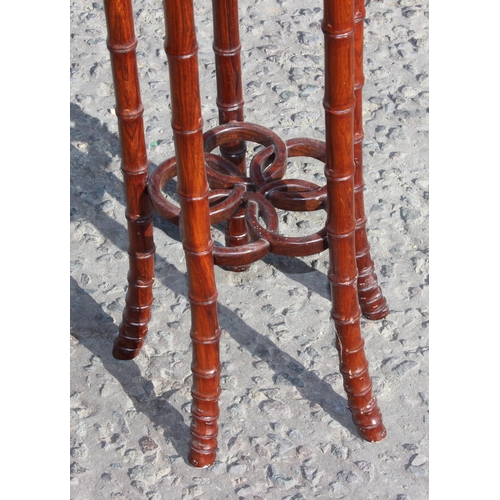 144 - A 20th century Chinese Rosewood jardinière or display stand with faux bamboo legs