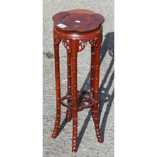 144 - A 20th century Chinese Rosewood jardinière or display stand with faux bamboo legs