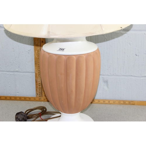 266 - A large white and terracotta ribbed table lamp