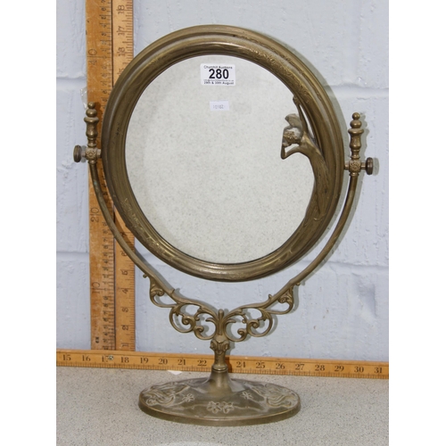 280 - An Art Nouveau style brass table top mirror with female figure