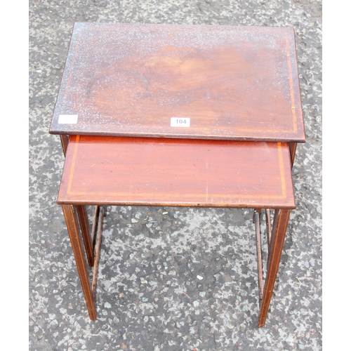 104 - An early 20th century mahogany nest of 2 tables