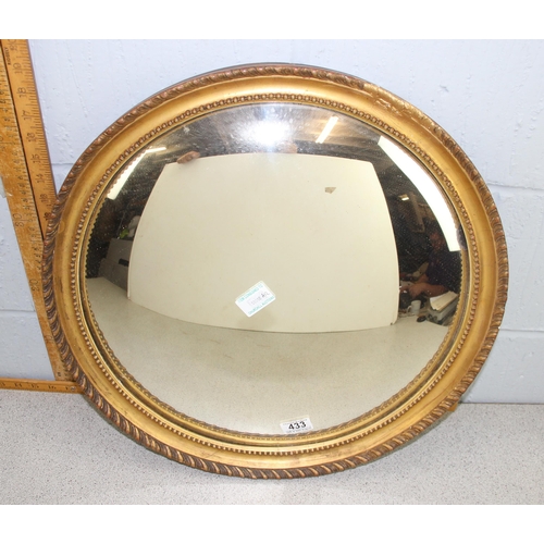 433 - An antique gilt framed convex wall mirror