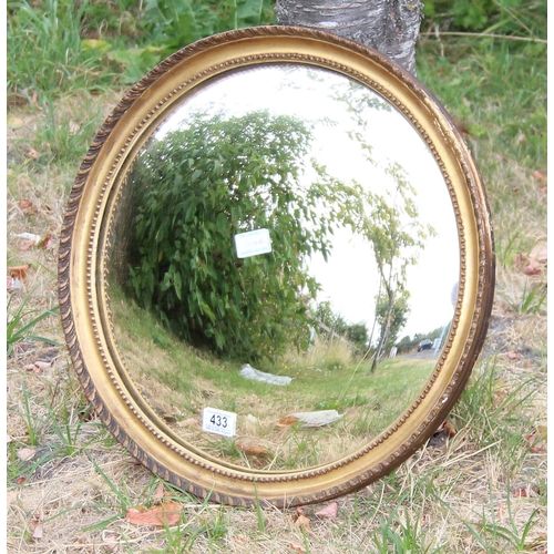 433 - An antique gilt framed convex wall mirror