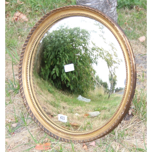 433 - An antique gilt framed convex wall mirror