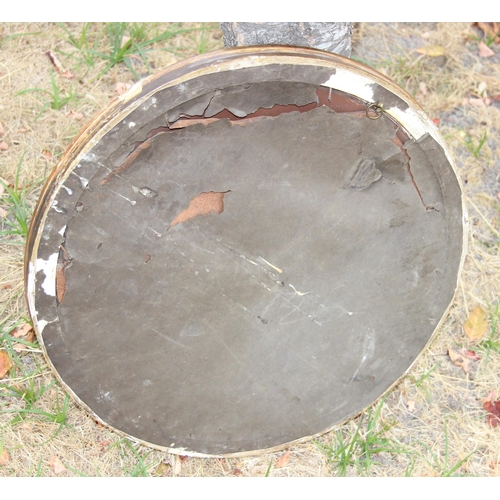 433 - An antique gilt framed convex wall mirror