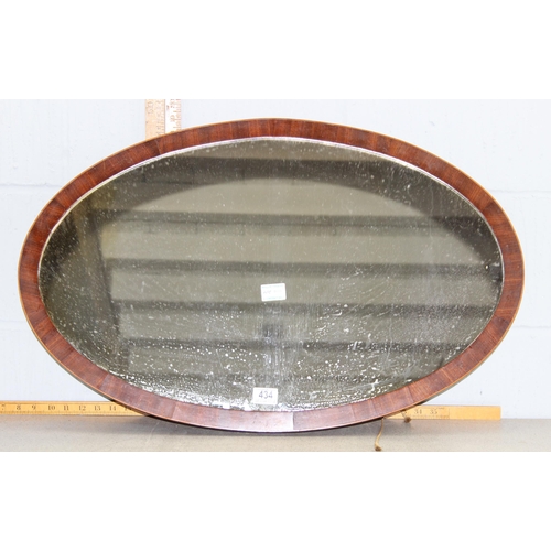 434 - Oval mahogany framed wall mirror