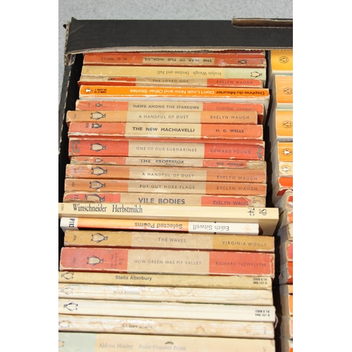 567 - A box of assorted vintage paperback books, mainly orange Penguin books