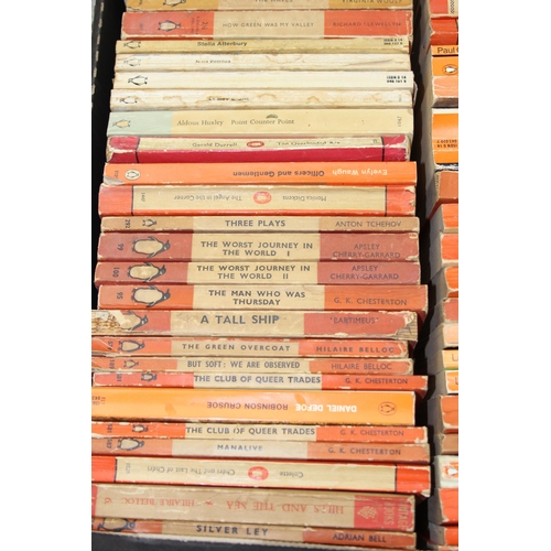 567 - A box of assorted vintage paperback books, mainly orange Penguin books