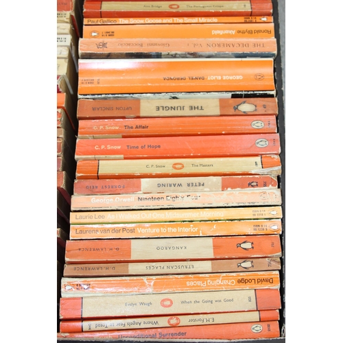 567 - A box of assorted vintage paperback books, mainly orange Penguin books