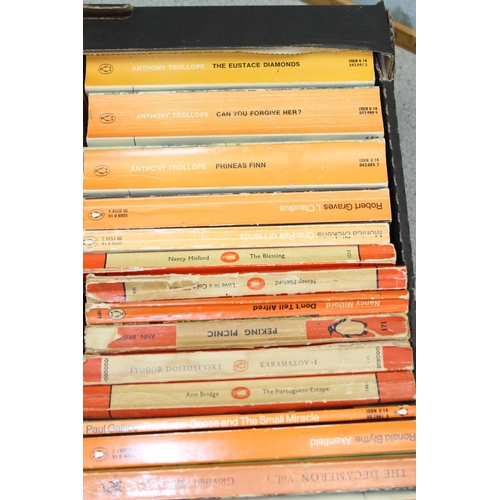 567 - A box of assorted vintage paperback books, mainly orange Penguin books