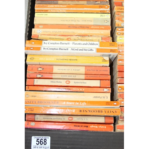 568 - A box of assorted vintage paperback books, mainly orange Penguin books