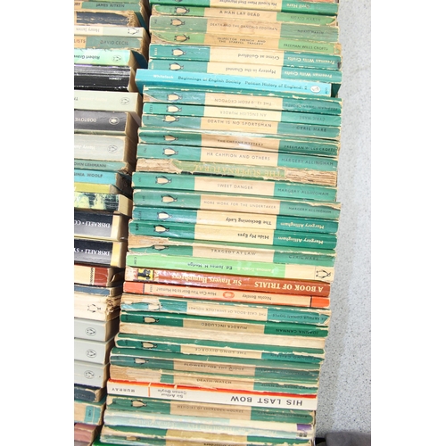 569 - A box of assorted vintage paperback books, mainly blue Penguin books