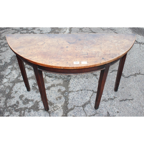 84 - A Georgian demilune mahogany table