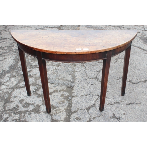 84 - A Georgian demilune mahogany table