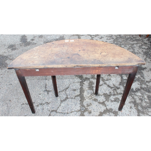 84 - A Georgian demilune mahogany table