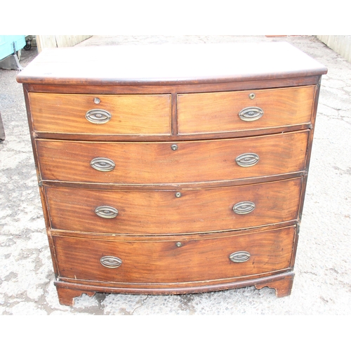 86 - A Georgian mahogany 2 over 3 bow front chest of drawers