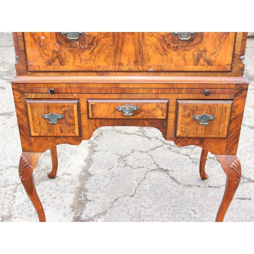 91 - A Queen Anne style walnut chest on stand with dressing slide, likely early 20th century, oak drawer ... 