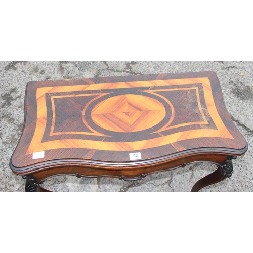 92 - An unusual antique cards table with contrasting geometric inlay, likely French