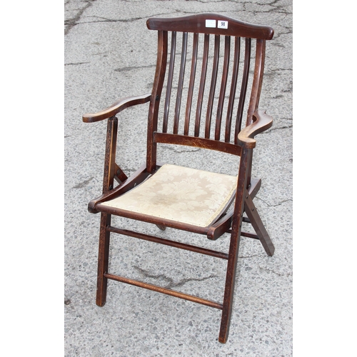 98 - An antique folding mahogany campaign chair