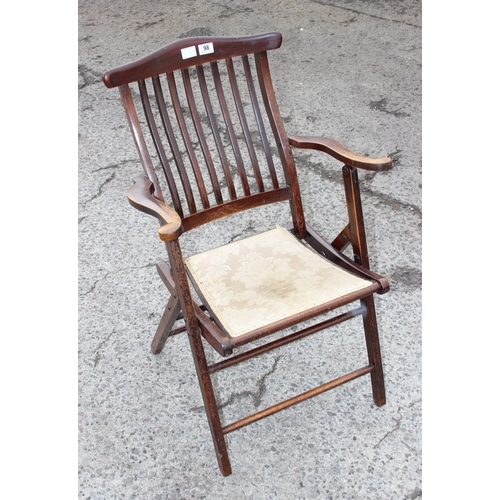 98 - An antique folding mahogany campaign chair