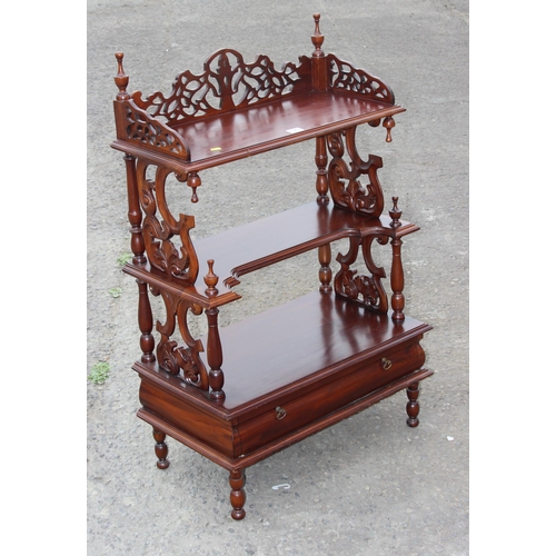 128 - A Victorian style mahogany 3 tier whatnot with fretwork ends and drawer