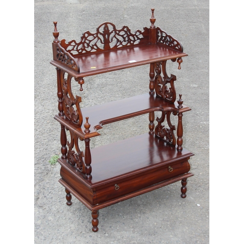 128 - A Victorian style mahogany 3 tier whatnot with fretwork ends and drawer