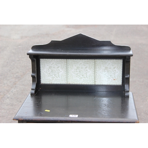 130 - An unusual antique ebonised cabinet with tile back and 2 drawers, the drawers containing 2 vintage g... 